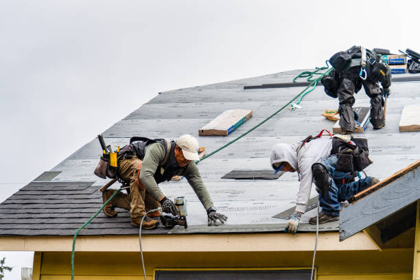 Professional Roofing technician working in Westdale, NY